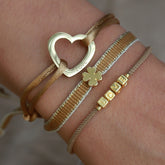 Lot de bracelets trèfle doré
